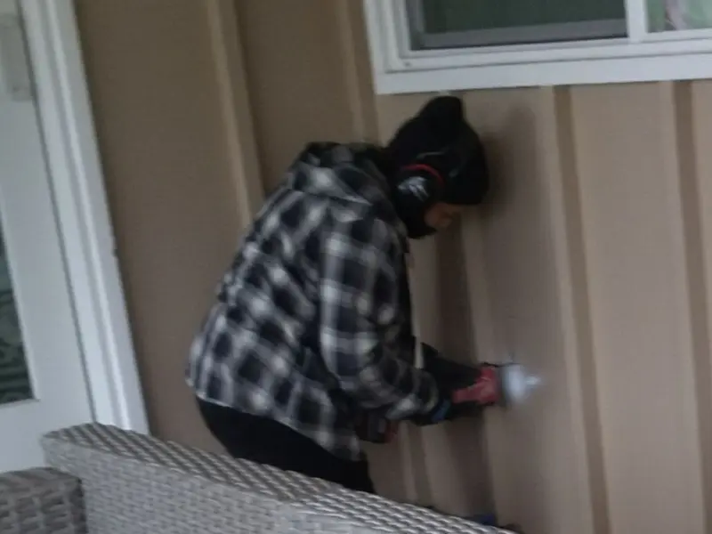 Professional electrician installing an exterior outlet in Hockessin